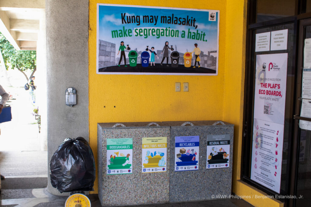 The Plastic Flamingo bins are made of 100% recycled plastic, and the waste segregation campaign materials are placed outside one of the port offices.